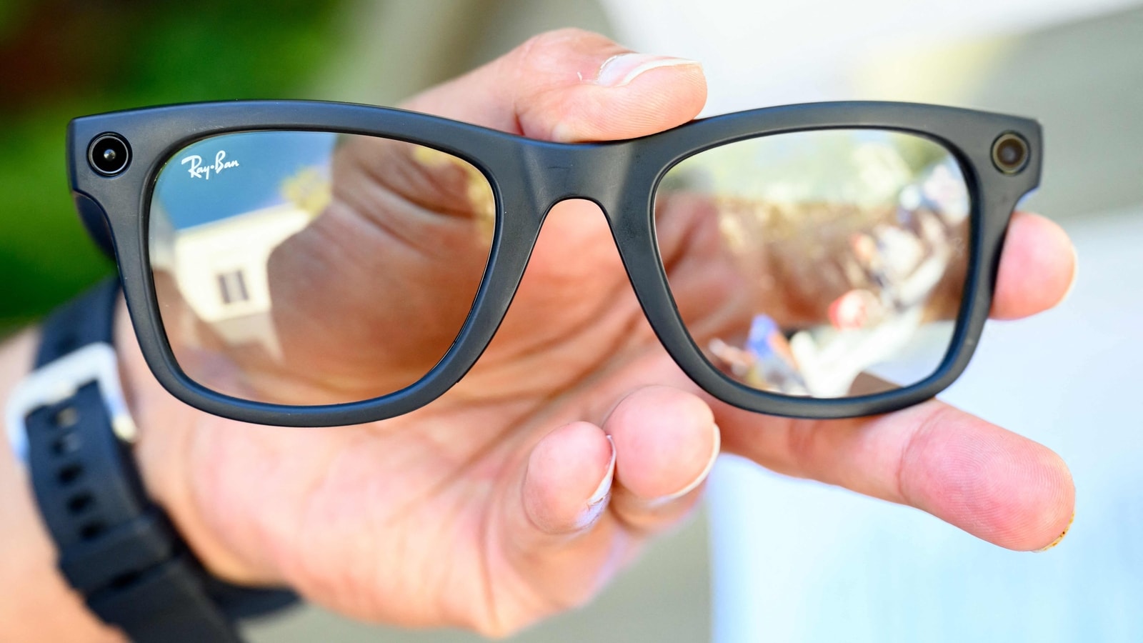 person wearing ray ban meta glasses speaking to AI assistant